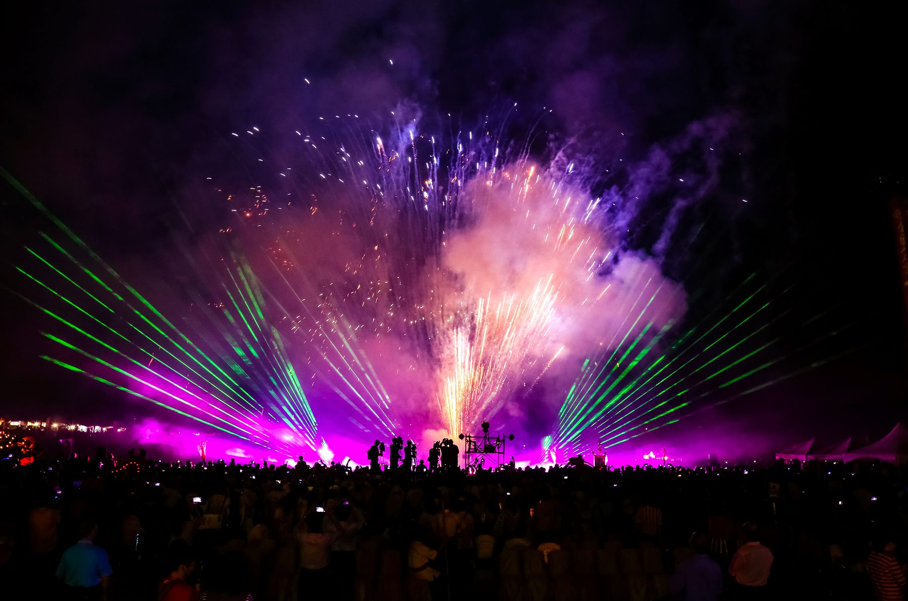 Lasers, smoke and pyro effects across a crowd